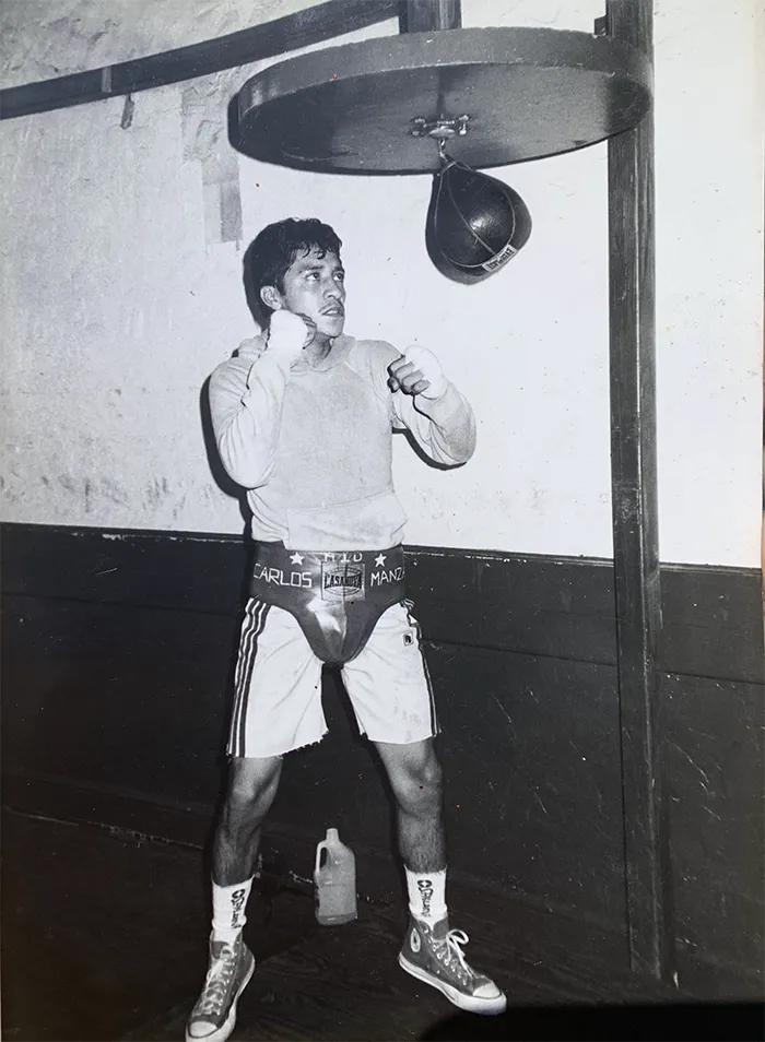 Carlos Manzano Jr. training on a speed bag